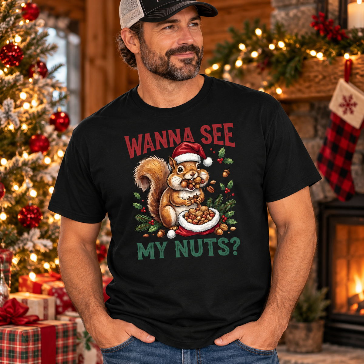 A black short-sleeve crewneck t-shirt featuring a Christmas-themed graphic of a squirrel wearing a Santa hat and eating nuts, with the text 'WANNA SEE MY NUTS?' in red and green lettering.