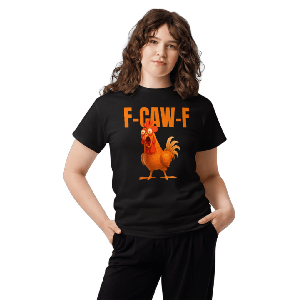 A woman modeling a black short-sleeve graphic t-shirt with orange text reading 'F-CAW-F' and a cartoon rooster illustration on the front, set against a plain white background.