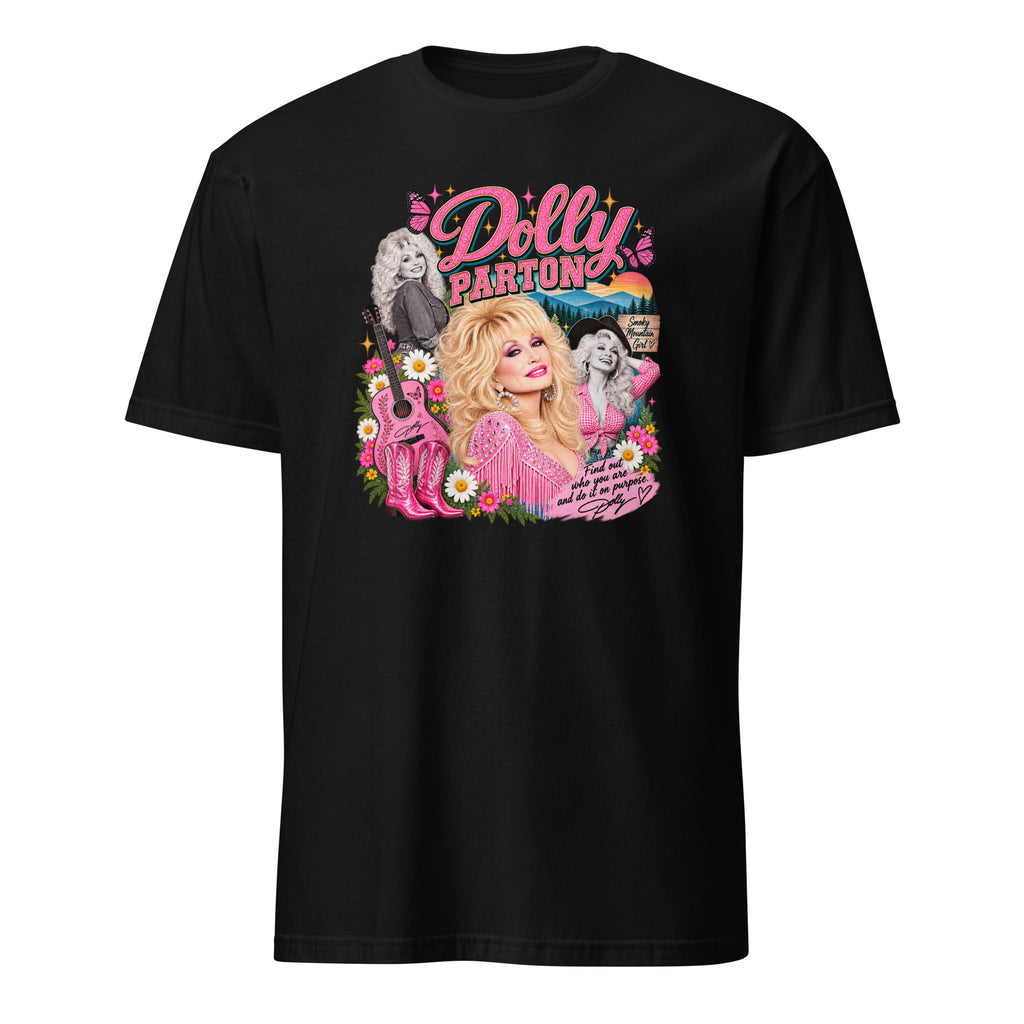 A black short-sleeve crewneck t-shirt featuring a colorful graphic print of Dolly Parton on the front, set against a plain white background.
