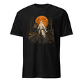 A black short-sleeve crewneck t-shirt featuring a detailed Halloween graphic on the front. The graphic depicts a ghost riding a bicycle down a spooky road with pumpkins, a haunted house, bare trees, and a large orange full moon.