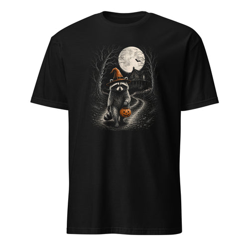 A black short-sleeve crewneck t-shirt featuring a Halloween-themed graphic print of a raccoon wearing an orange witch hat and holding a jack-o'-lantern in a spooky forest under a full moon.