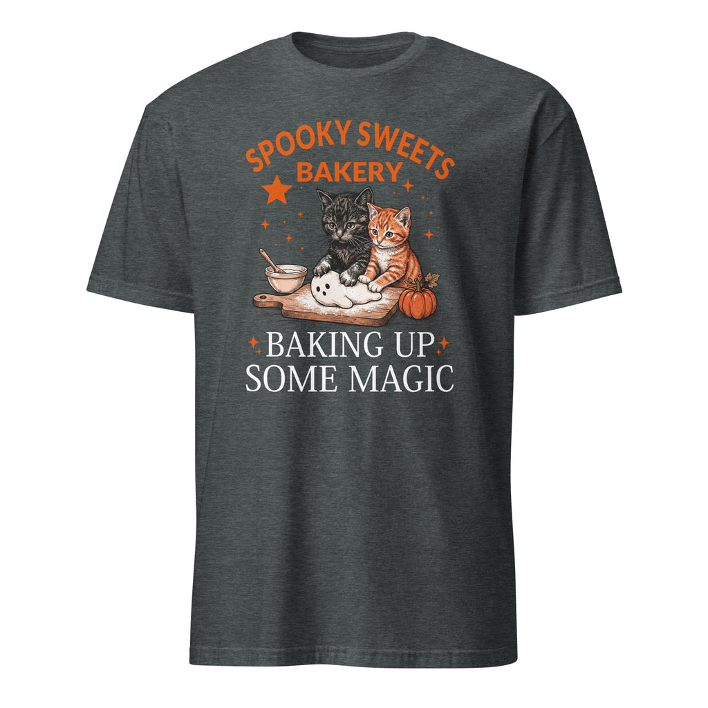 A dark heather gray t-shirt with a graphic print featuring two cats baking with the text 'SPOOKY SWEETS BAKERY' and 'BAKING UP SOME MAGIC'.