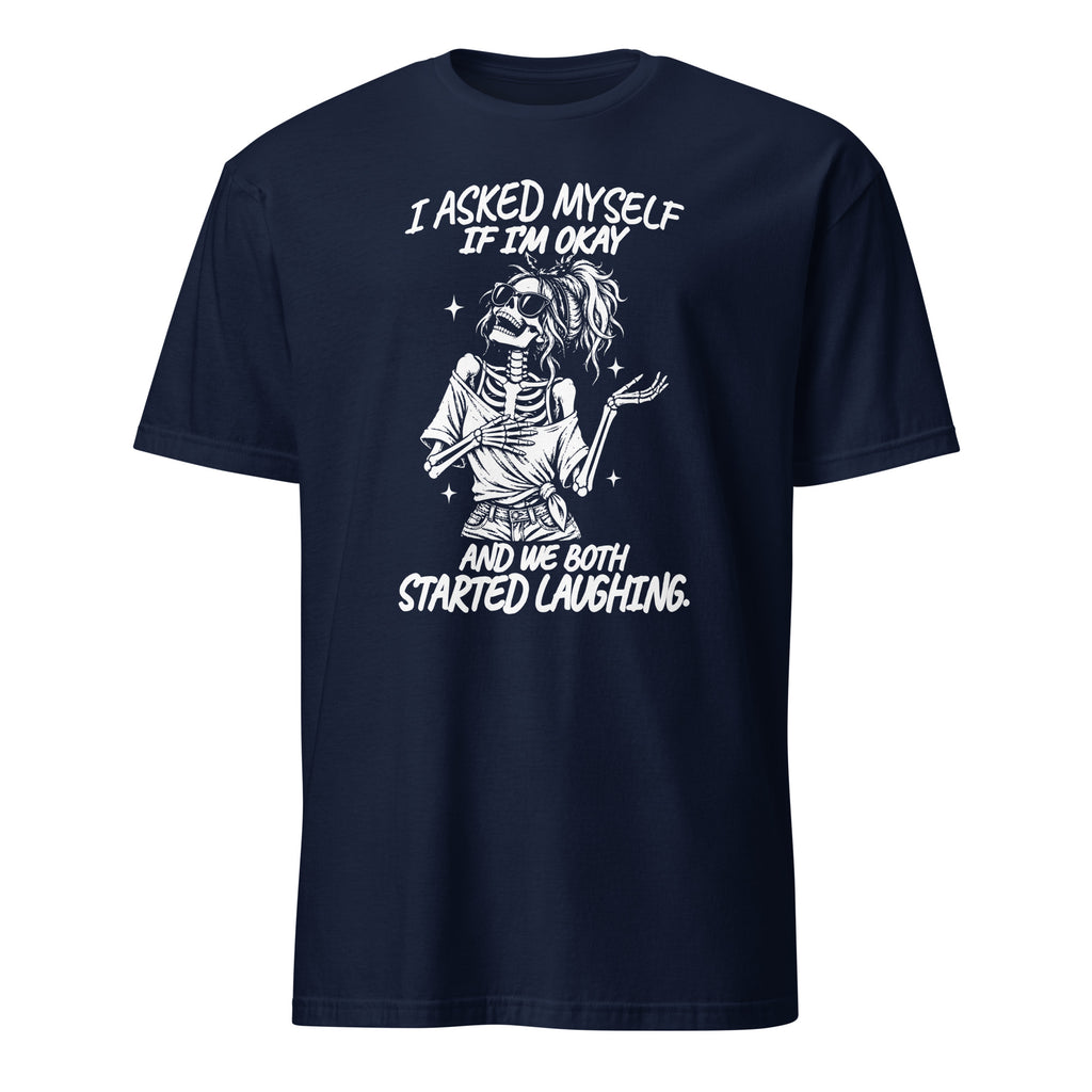 A navy blue short-sleeve t-shirt with a white graphic print of a skeleton zombie holding a phone, with the text 'I ASKED MYSELF IF I'M OKAY AND WE BOTH STARTED LAUGHING.' on a plain white background.