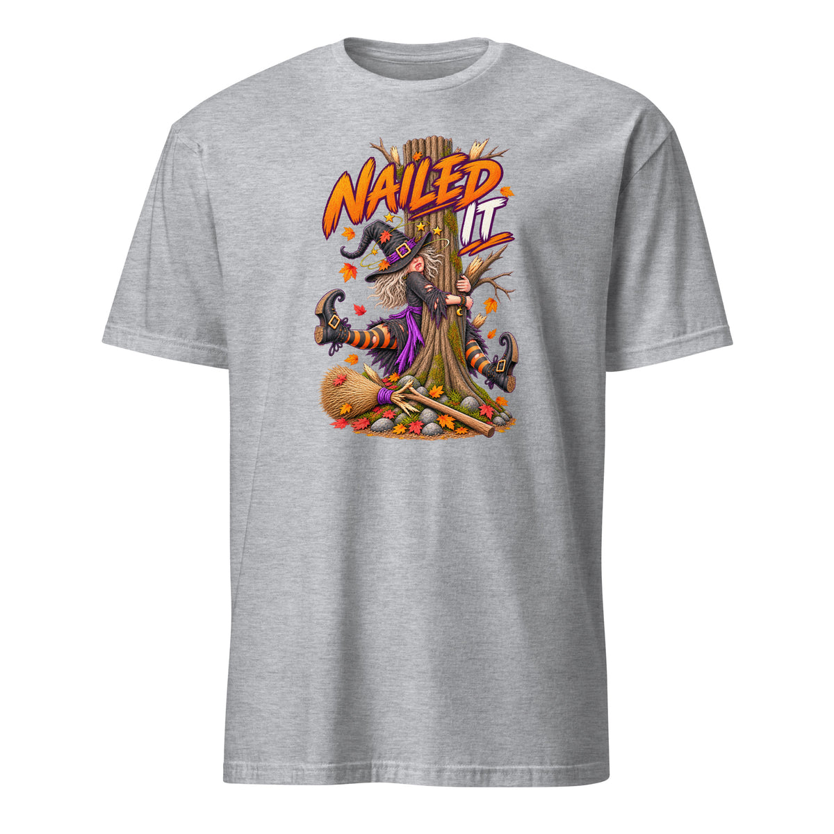 A heather gray short-sleeve crewneck t-shirt featuring a colorful graphic of a witch hanging from a tree with the text 'NAIL IT' in orange and yellow.