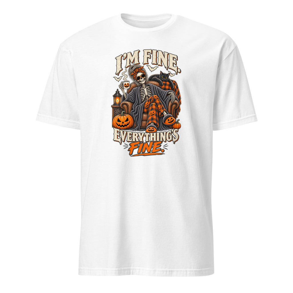 A white short-sleeve crewneck t-shirt featuring a Halloween-themed graphic print on the front. The graphic shows a skeleton in a plaid shirt sitting in a pumpkin-studded cart with the text 'I'M FINE.