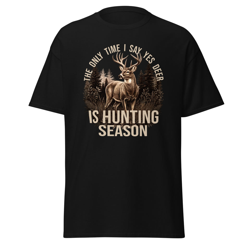 A black short-sleeve t-shirt with a graphic print of a deer in a forest and the text 'THE ONLY TIME I SAY YES DEER IS HUNTING SEASON' in beige, shown on a plain white background.