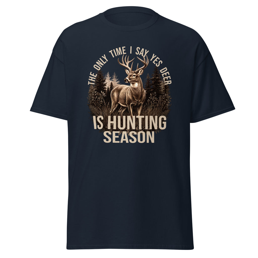 A navy blue short-sleeve t-shirt with a graphic print of a deer in a forest and the text 'THE ONLY TIME I SAY YES DEER IS HUNTING SEASON' in beige.