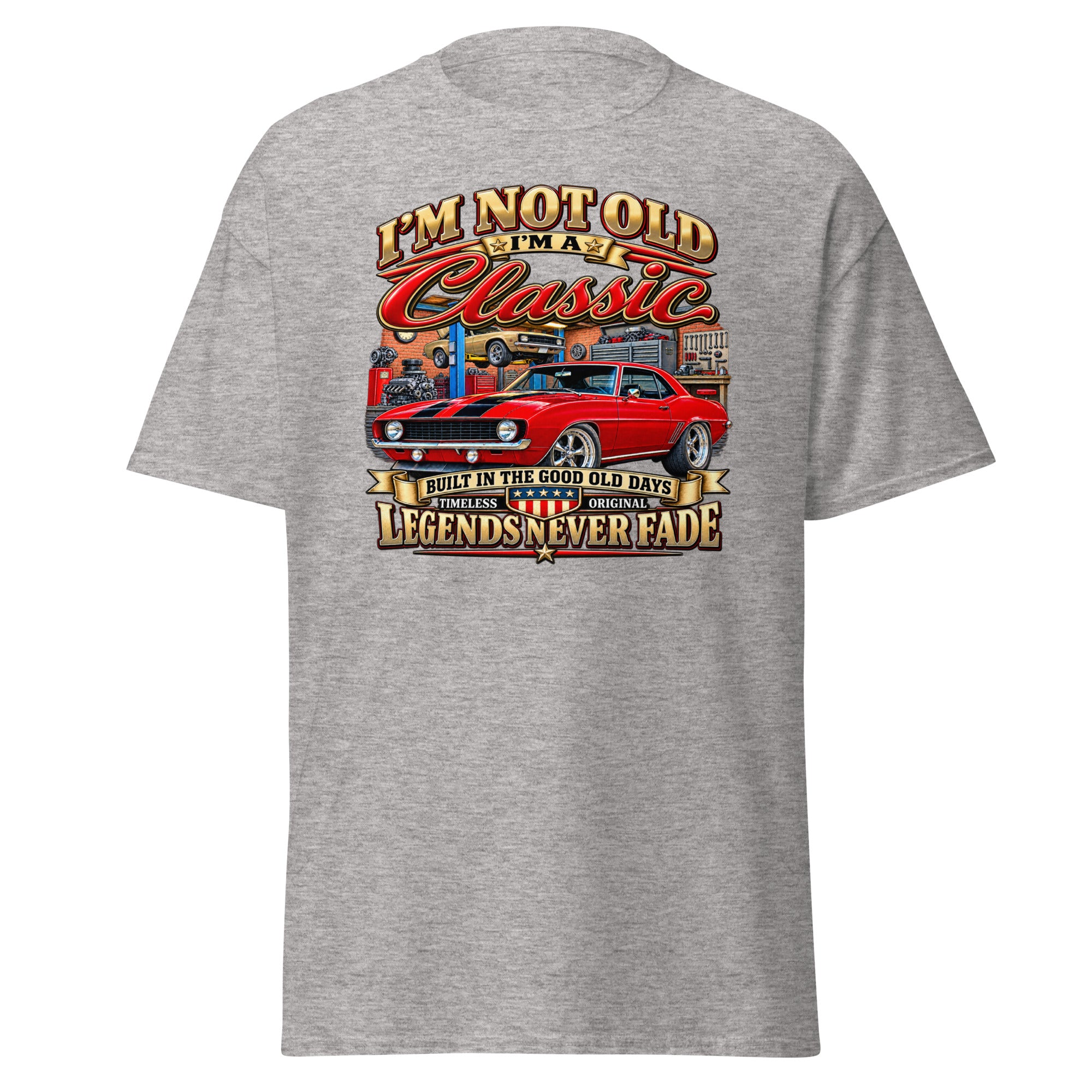 A heather gray short-sleeve t-shirt with a large graphic print on the back. The graphic features a red muscle car and stylized text reading 'I'M NOT OLD WHEN Classic' and 'LEGENDS NEVER FADE'.