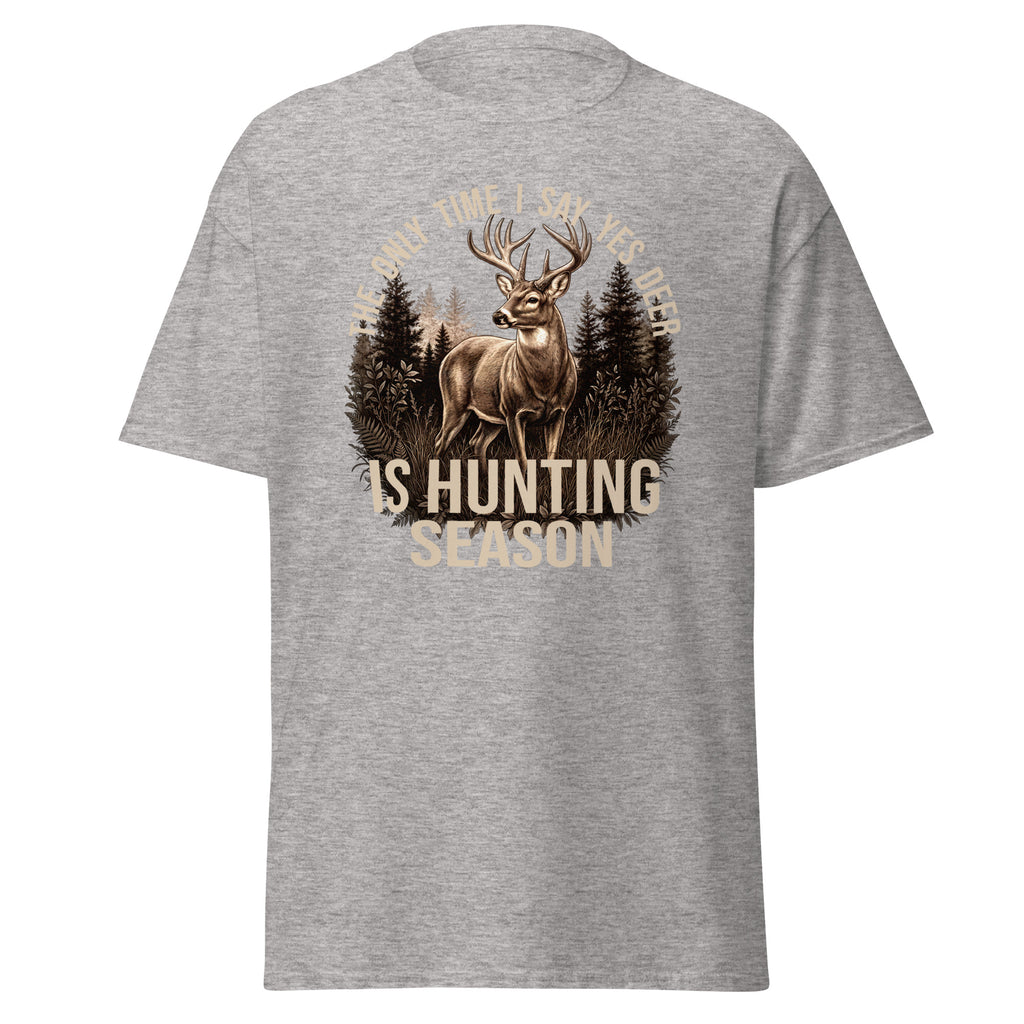 A heather gray short-sleeve t-shirt with a large graphic on the front featuring a deer in a forest and the text 'ONLY TIME I SPY HIS FEELING IS HUNTING SEASON' in beige and dark brown tones.