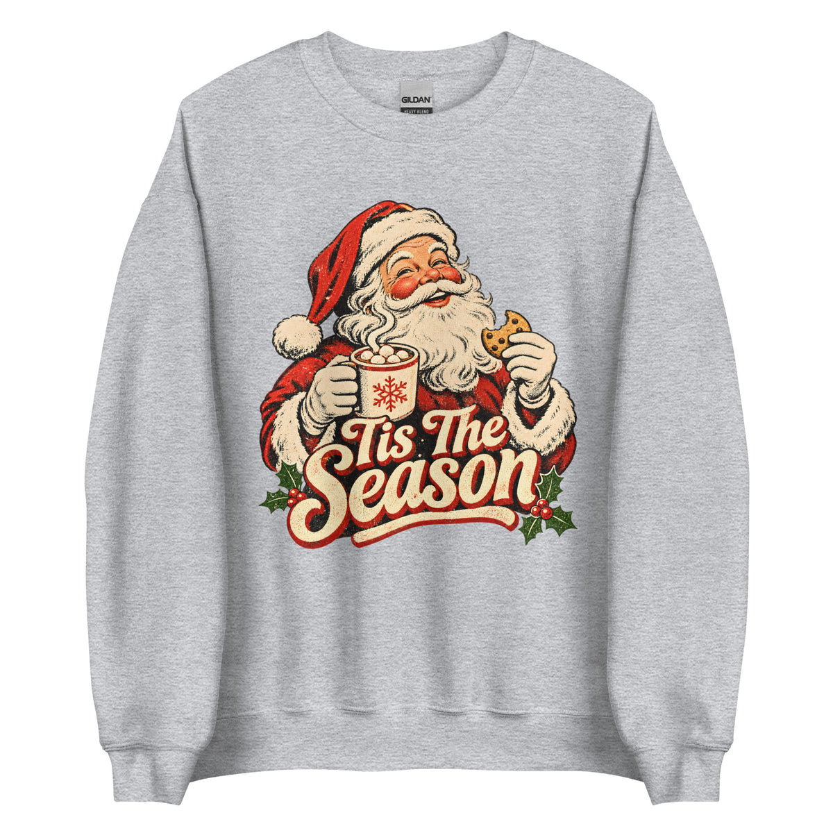 A light heather gray crewneck sweatshirt featuring a vintage-style graphic of Santa Claus holding a mug and cookie with the text 'Tis The Season' in red and cream lettering.