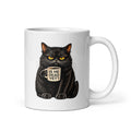 A white ceramic coffee mug featuring a graphic illustration of a grumpy black cat with yellow eyes holding a smaller mug that reads 'IS HE DEAD YET?'.